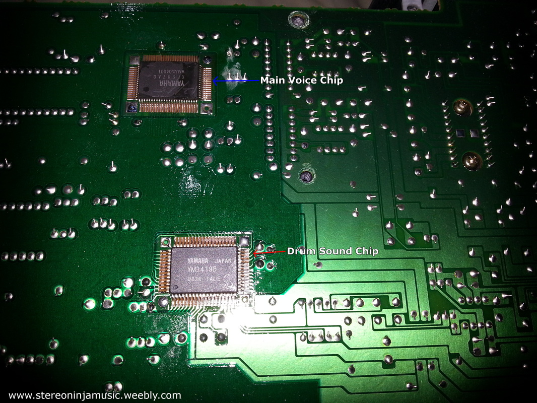 A close up image of the inside of this keyboard showing the sound chips used by the main voice and drums